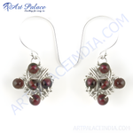 Load image into Gallery viewer, Sterling silver dangle earrings with wire-wrapped design and red garnet gemstones.