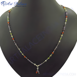 Load image into Gallery viewer, Sterling silver beaded necklace with colorful gemstones displayed on a black mannequin
