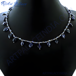 Load image into Gallery viewer, Silver gemstone beaded necklace on a black background. Delicate chain necklace with blue teardrop stones.