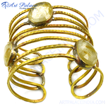 Load image into Gallery viewer, gold plating-toned metal cuff bracelet with rutilated quartz gemstones. A unique and elegant statement piece for women.