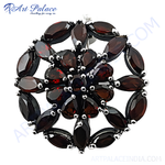 Load image into Gallery viewer, Sterling silver pendant with a floral arrangement of marquise-cut garnet gemstones, showcasing a deep red color.