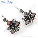 Load image into Gallery viewer, 925 sterling silver dangle earrings with red garnet gemstones in a flower design.