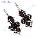 Load image into Gallery viewer, 925 sterling silver dangle earrings with vibrant red garnet gemstones.