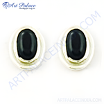 Load image into Gallery viewer, Sterling silver stud earrings with a black oval-shaped onyx gemstone.