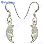 Load image into Gallery viewer, Sterling silver crescent moon dangle earrings with detailed facial features.