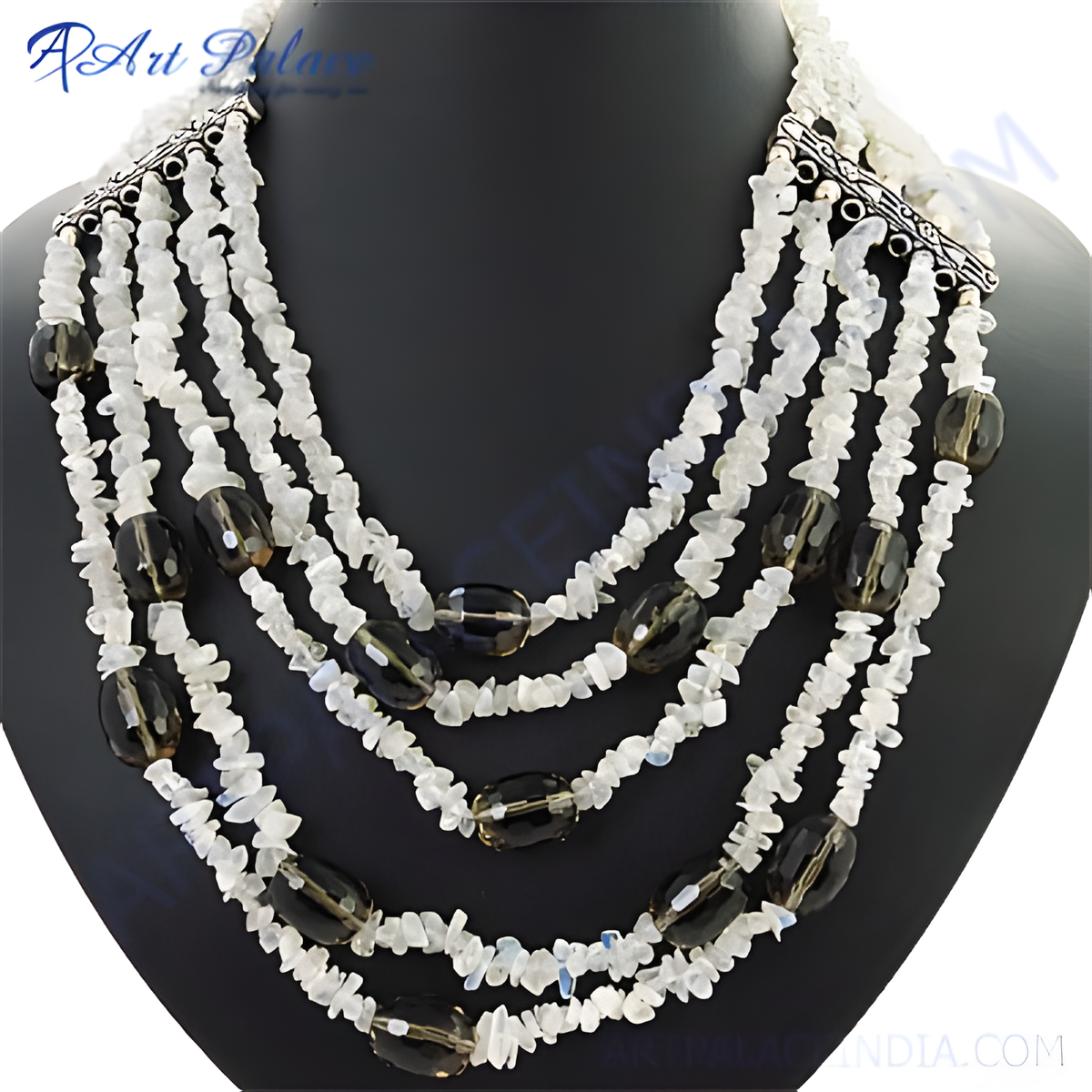 Multi strand necklace featuring white gemstone chips and smoky quartz beads on a black mannequin