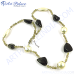 Load image into Gallery viewer, A stunning necklace featuring onyx and pearl beads on a white surface.