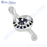 Load image into Gallery viewer, 925 sterling silver treble clef pendant with blue sapphire gemstones.