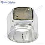 Load image into Gallery viewer, Sterling silver ring with a rectangular gemstone set in a wide band design. The ring is highly polished and eye-catching.