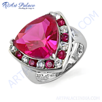 Load image into Gallery viewer, Sterling silver ring featuring a large trillion-cut ruby gemstone with surrounding accent stones, a vibrant red color