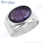 Load image into Gallery viewer, Sterling silver signet ring with a large oval-shaped purple gemstone set in a polished silver band.