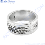 Load image into Gallery viewer, Sterling silver textured ring with a detailed design on a white background, showcasing the ring's polished finish and craftsmanship