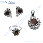 Load image into Gallery viewer, Sterling silver jewelry set with red garnet gemstones. Includes earrings, ring and pendant.