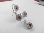 Load image into Gallery viewer, 925 sterling silver jewelry set featuring ruby-colored gemstones in a flower design: ring, earrings, and pendant.