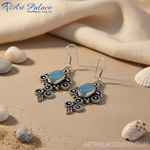 Load image into Gallery viewer, 925 sterling silver drop earrings with oval blue gemstones and intricate detailing