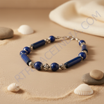 Load image into Gallery viewer, Blue gemstone beaded necklace displayed on a black mannequin, featuring a variety of bead shapes and silver accents.