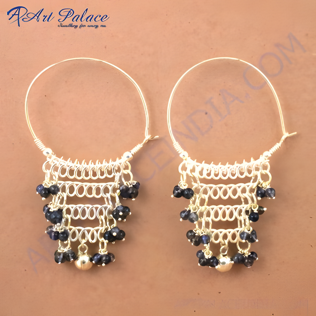 925 sterling silver dangle earrings with blue gemstone accents.