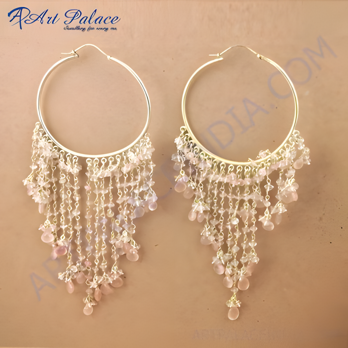 Gold plating hoop earrings with cascading strands of light pink gemstones, creating a beautiful dangle effect