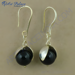Load image into Gallery viewer, Sterling silver dangle earrings with large black onyx gemstone balls and silver hooks.
