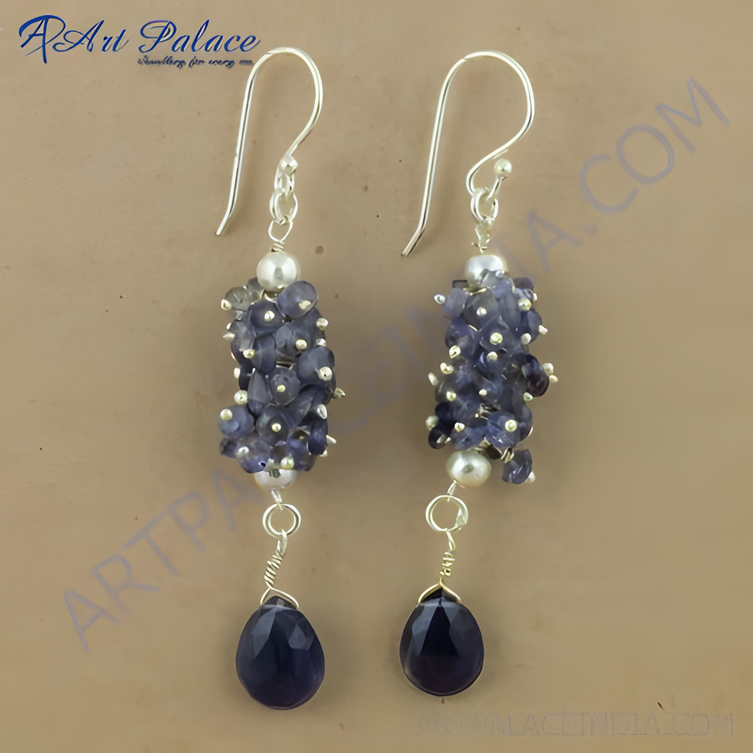 Sterling silver drop earrings featuring clusters of iolite gemstones and pear-shaped drops in a deep blue hue
