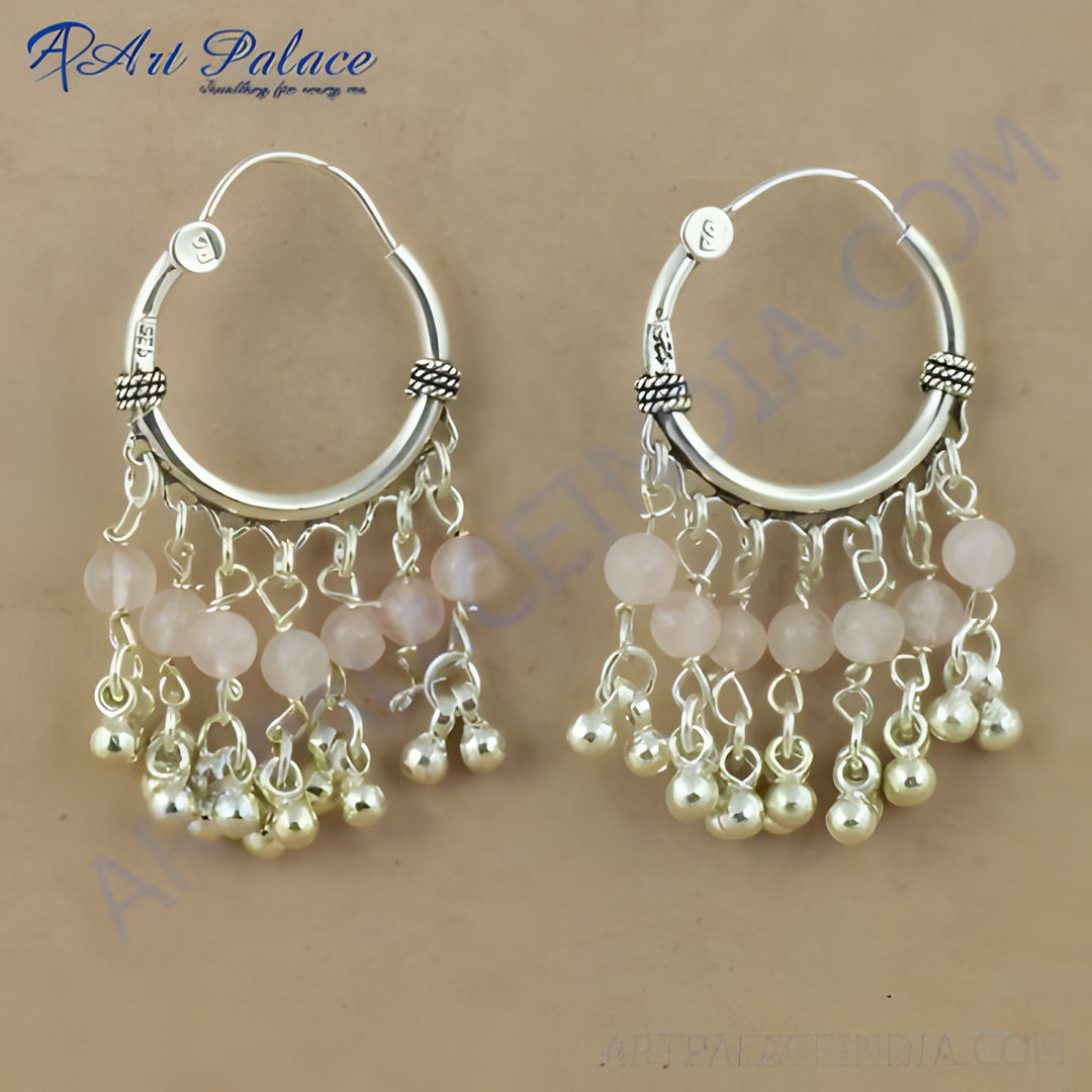 925 sterling silver dangle earrings featuring pink rose quartz beads and silver accents.