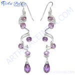 Load image into Gallery viewer, Sterling silver dangle earrings with faceted purple amethyst gemstones on a white background.
