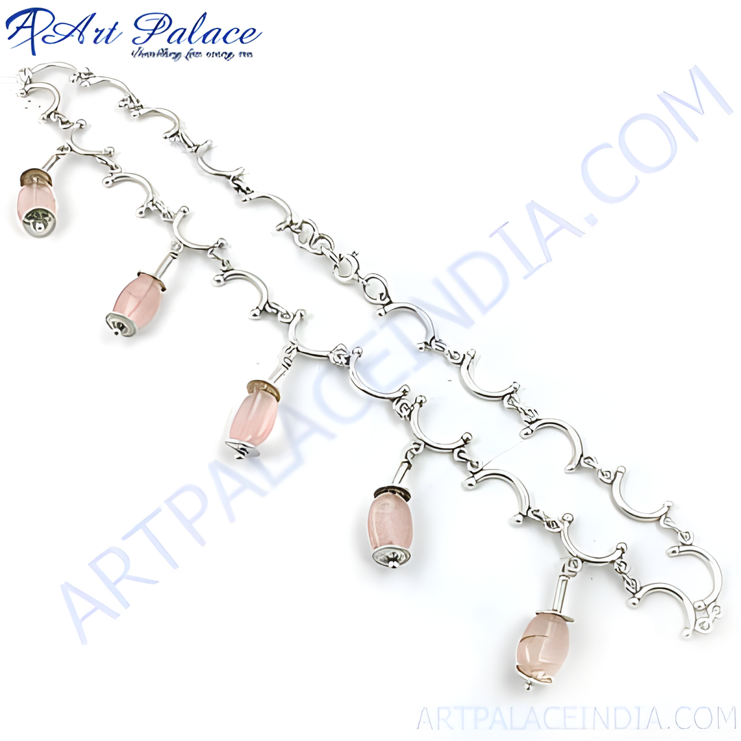 Sterling silver necklace with dangling pink rose quartz gemstones. Elegant and delicate.