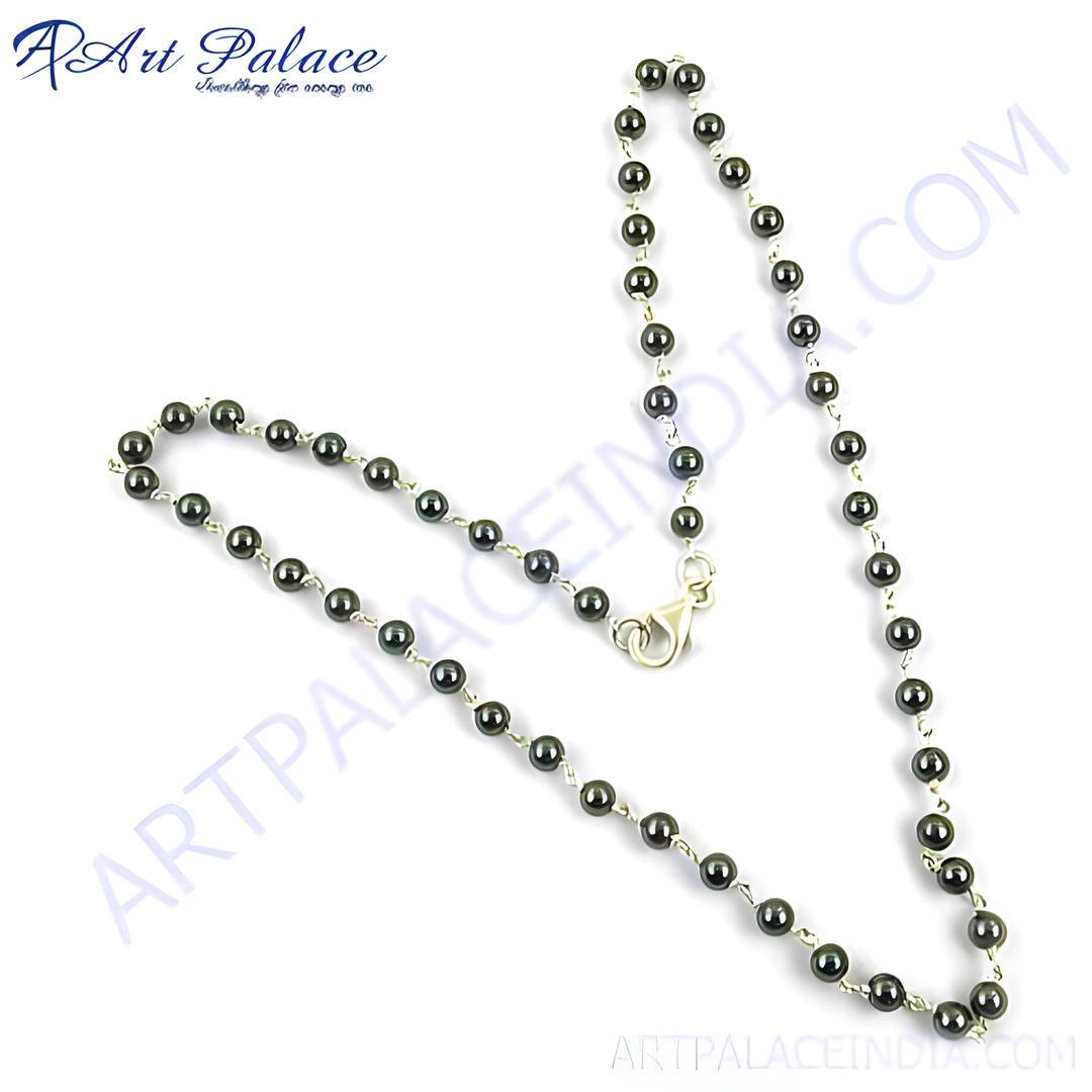 Sterling silver beaded necklace with dark gemstones for women. Elegant and stylish.