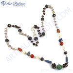 Load image into Gallery viewer, A colorful gemstone beaded necklace featuring various shapes and colors on a white background.
