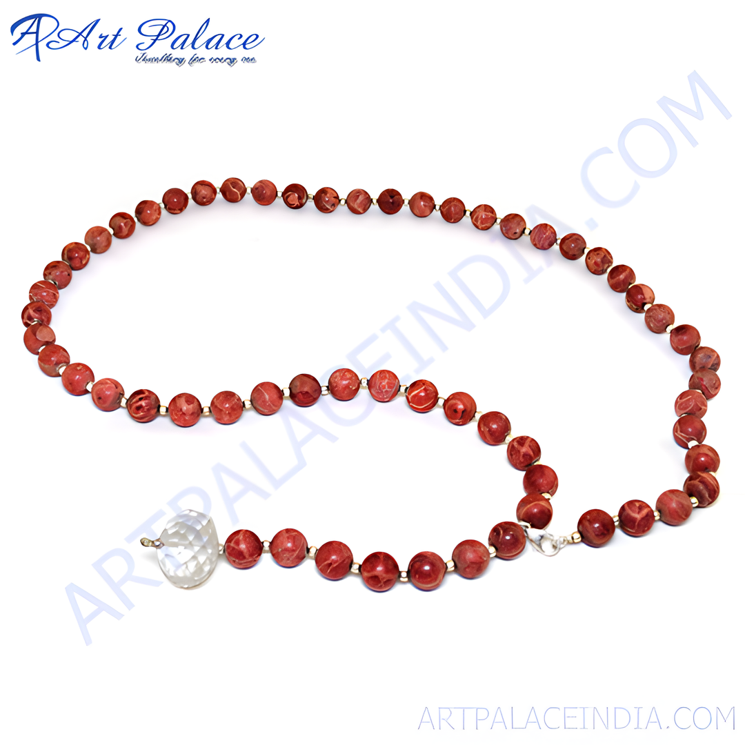 Red Jasper beaded necklace with crystal pendant, featuring red and clear gemstones.