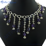 Load image into Gallery viewer, Sterling silver necklace with amethyst gemstones. Purple amethyst dangle necklace on a black display.

