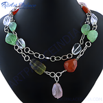 Load image into Gallery viewer, Gemstone beaded necklace with sterling silver chain on a black jewelry display

