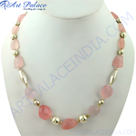Load image into Gallery viewer, Pink rose quartz beaded necklace with gold plating accents, displayed on a mannequin, women&#39;s fashion jewelry.
