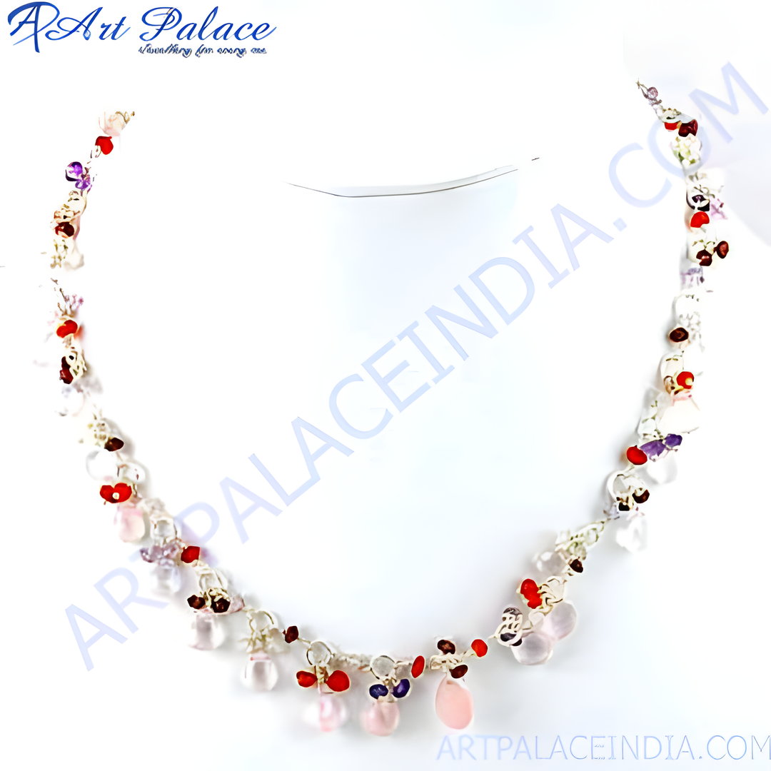 A stunning gemstone beaded necklace crafted from 925 sterling silver. Features red, pink and purple gemstones on a white background.