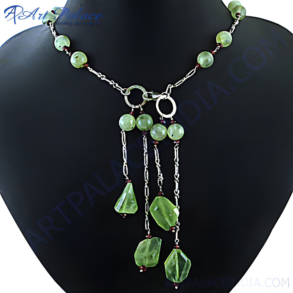 Silver tassel necklace featuring green stones, a unique and stylish jewelry piece