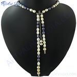 Load image into Gallery viewer, Freshwater pearl lariat necklace on a black mannequin, featuring a y-shaped design with mixed white and dark pearls
