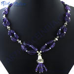 将图像加载到图库查看器中， Amethyst gemstone tassel necklace in silver setting on a black display. Purple necklace, silver accents, jewelry.
