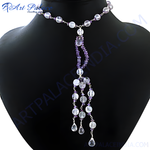 Load image into Gallery viewer, Amethyst and crystal beaded lariat necklace on a black mannequin, featuring purple and clear gemstones.
