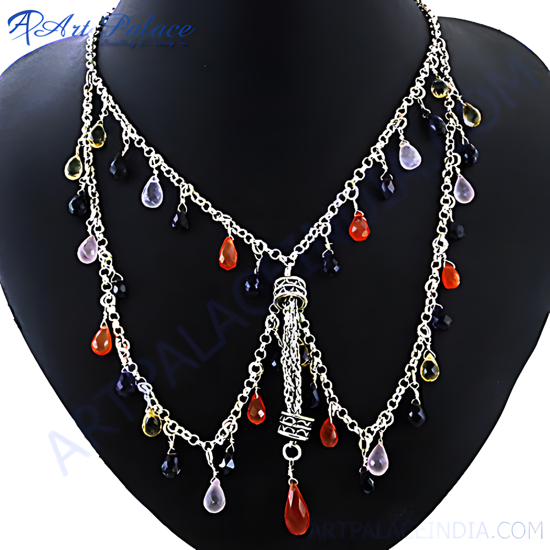 Silver cascade necklace with colorful gemstones displayed on a black mannequin.