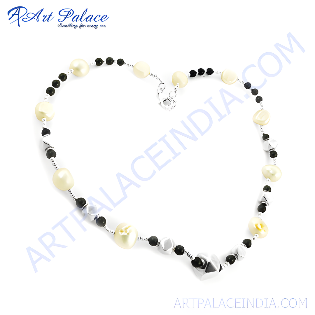 Sterling silver beaded necklace with white pearls, black onyx beads, and a silver clasp