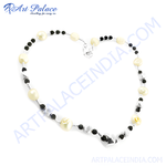 Load image into Gallery viewer, Sterling silver beaded necklace with white pearls, black onyx beads, and a silver clasp

