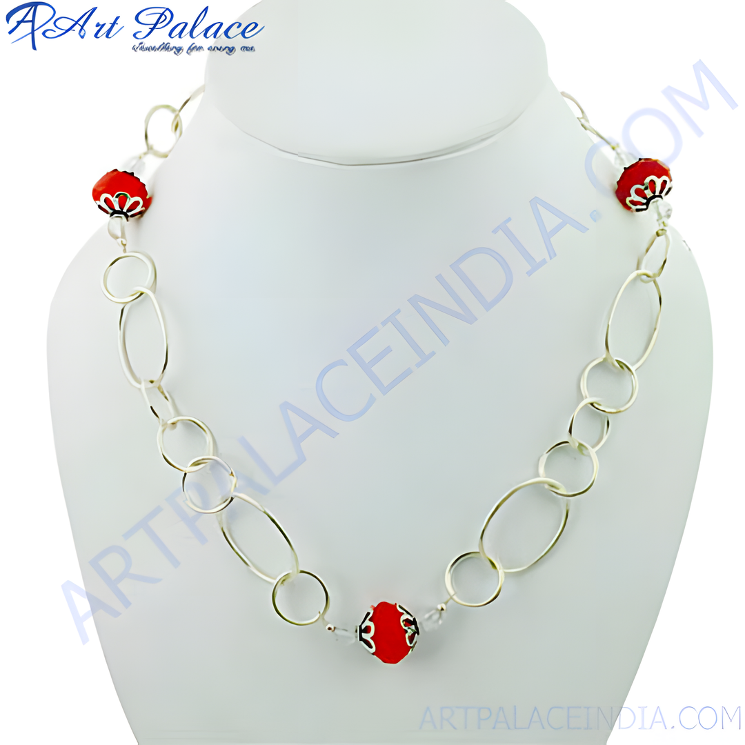 A red beaded chain necklace on a white mannequin, displaying a modern design for women.