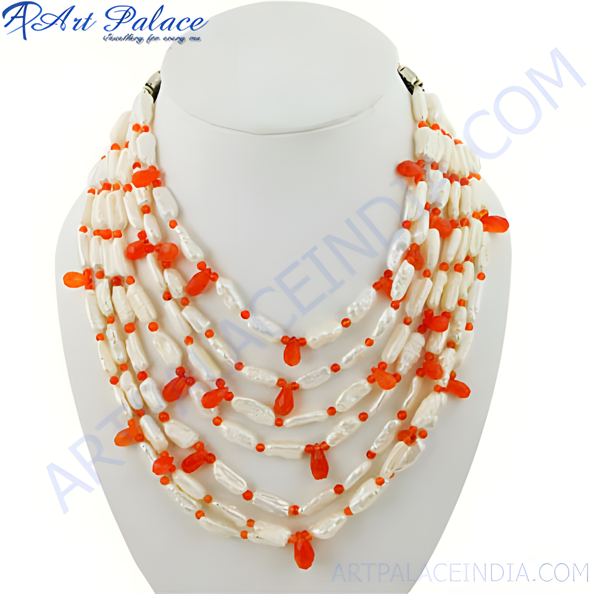 Multi strand pearl and coral statement necklace on a white display