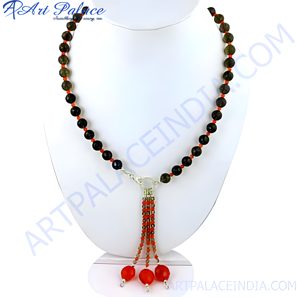A stunning beaded gemstone necklace with dark round beads and red accents, displayed on a jewelry stand