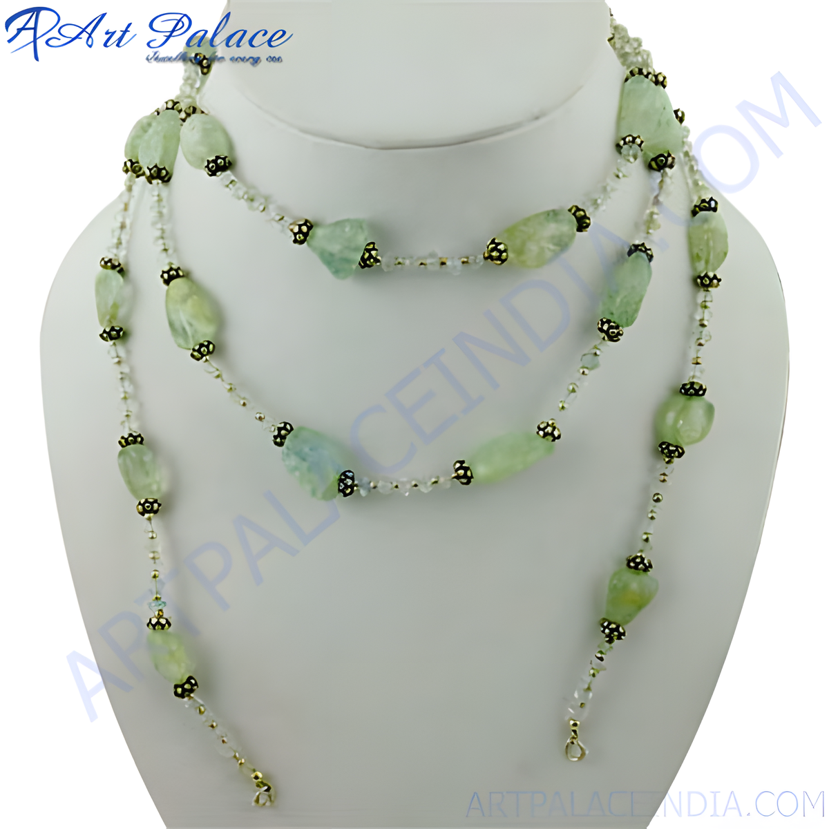 Layered green gemstone beaded necklace on a white mannequin