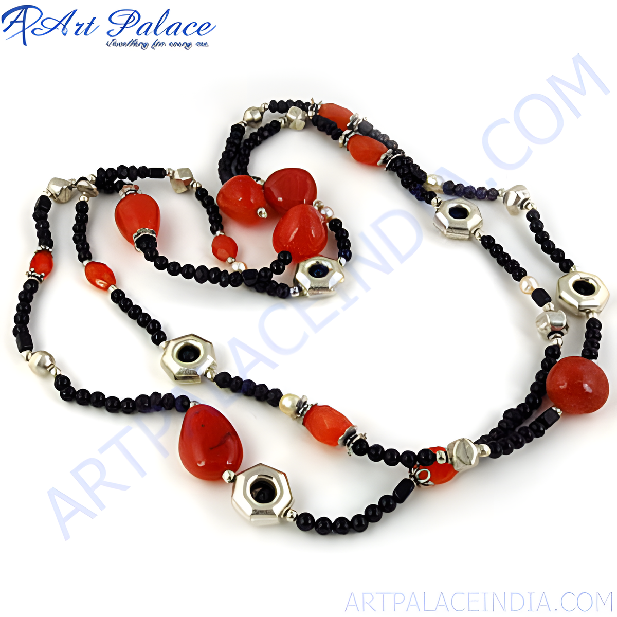 Red coral beaded necklace with black beads and silver accents on a white background, showcasing the jewelry's design
