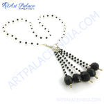 Load image into Gallery viewer, Clear quartz and onyx bead tassel necklace. Black onyx and clear quartz beads with a silver clasp.
