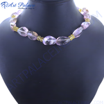 Load image into Gallery viewer, Pink and yellow quartz gemstone beaded necklace on a dark display.
