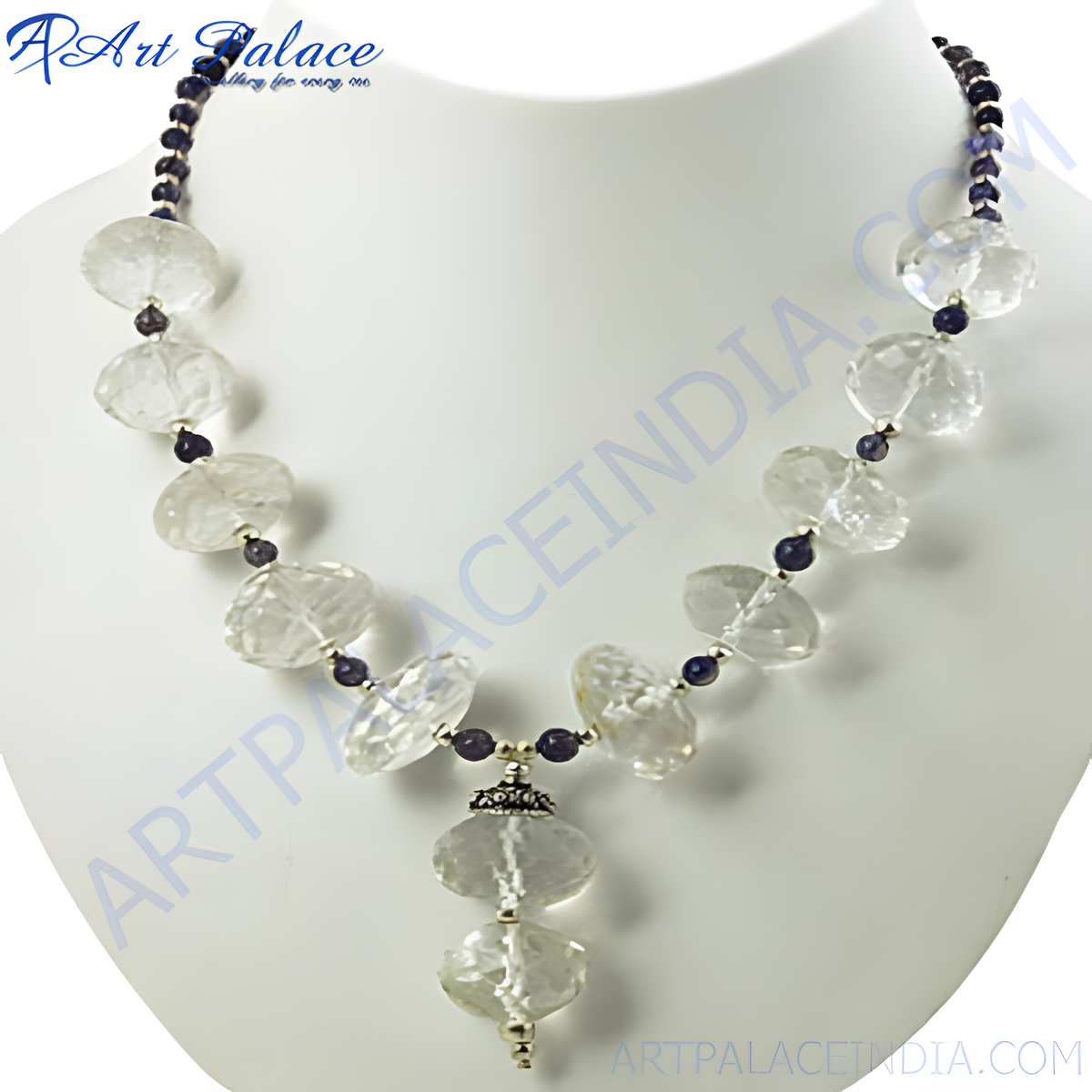 Quartz and iolite beaded necklace with clear and blue gemstones on a white mannequin