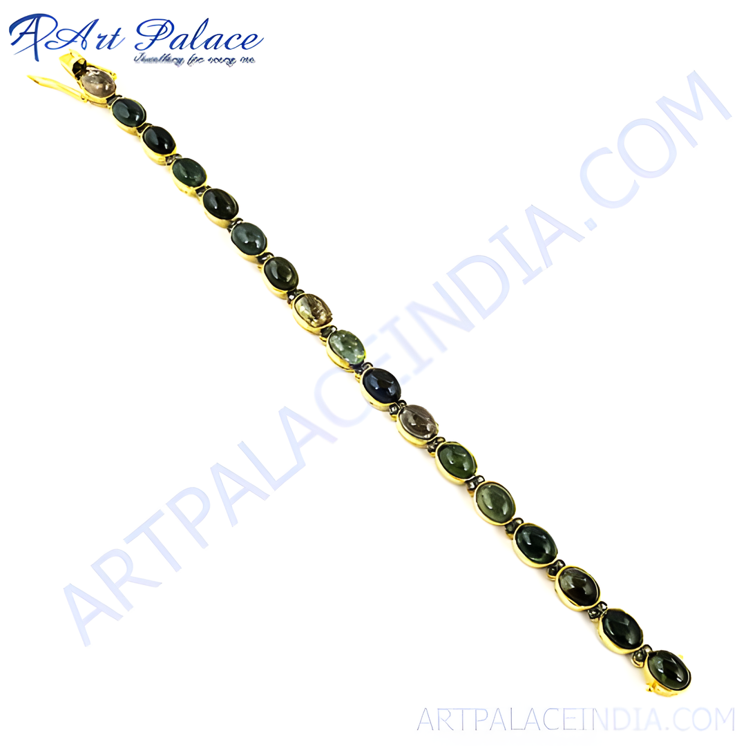 Gold chain bracelet with oval green tourmaline gemstones set in gold.